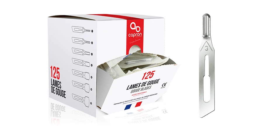 gros plan d'une lame de gouge et sa boîte de 125